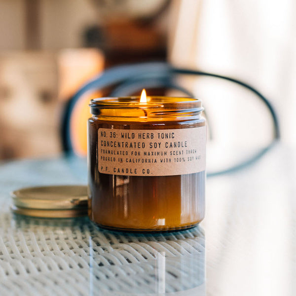P.F. Candle Co. Wild Herb Tonic Large Concentrated Candle -  Lifestyle - Barefoot walks through wild herb gardens, cool mountain stream baths, crisp morning air. Aromatic, camphorous, earthy. Lemon balm, crushed thyme, orange rind, and fir.