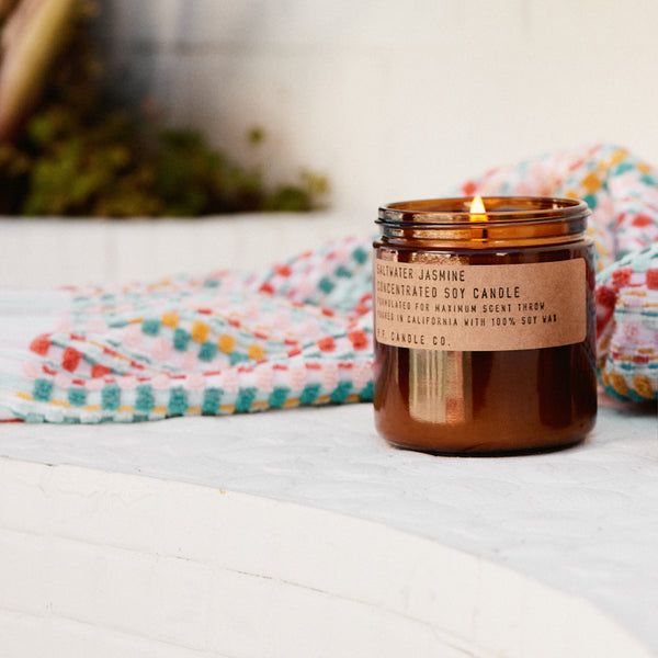 P.F. Candle Co. Saltwater Jasmine Large Concentrated Candle - Lifestyle - Coastal mornings blanketed in a gentle marine layer, the warmth of the rising sun, wild white blossoms collecting dew. Ozonic, crisp, clean. Bergamot, sea moss, and sandalwood.