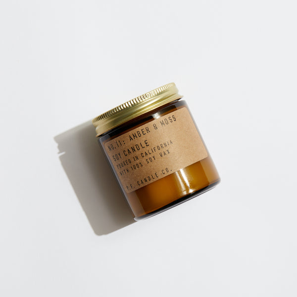 P.F. Candle Co. Amber & Moss Mini Candle - Product - Hand-poured into apothecary inspired amber jars with our signature kraft label and a brass lid.
