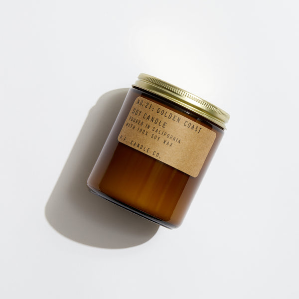 P.F. Candle Co. Golden Coast Standard Candle - Product - Hand-poured into apothecary inspired amber jars with our signature kraft label and a brass lid.
