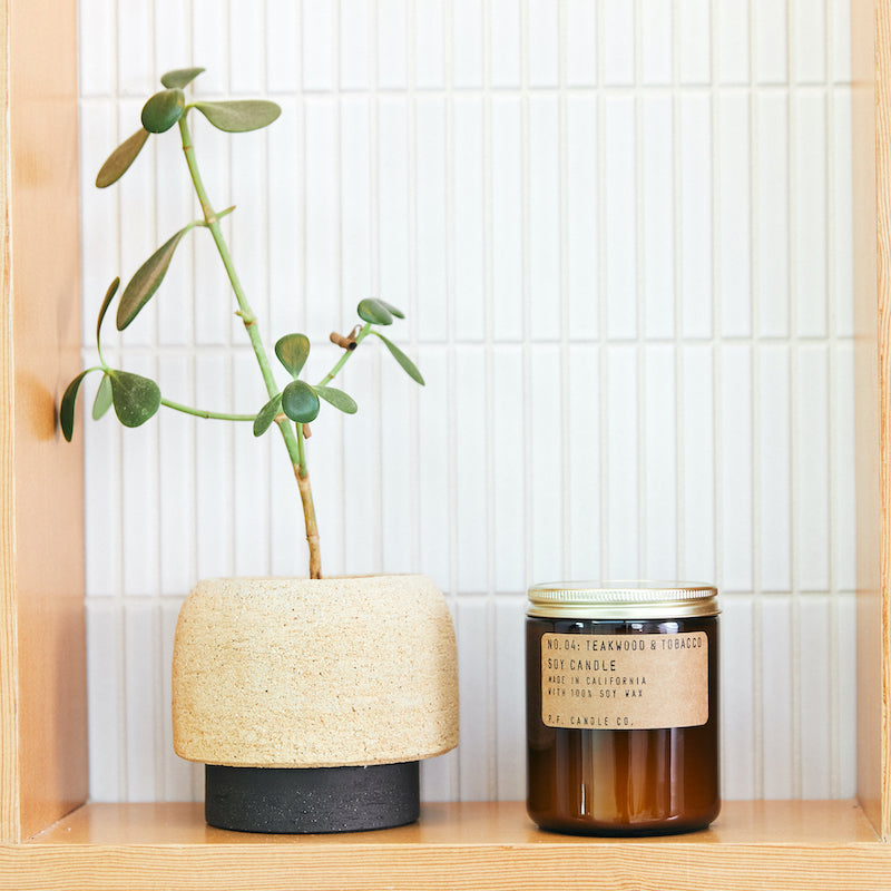 P.F. Candle Co. Teakwood & Tobacco Standard Candle - Lifestyle - The one that started it all. Some call it the boyfriend scent, we call it the O.G. Leather, teak, and orange.