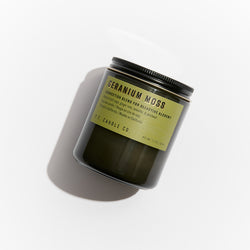 P.F. Candle Co. Los Angeles - Geranium Moss Alchemy 7.2 oz Standard Scented Soy Wax Candle - Product - Alchemy Candles feature smoke-colored glass vessels, black metal lids, and gold-leafed labels inspired by vintage window lettering.