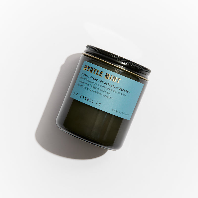 P.F. Candle Co. Los Angeles - Myrtle Mint Alchemy 7.2 oz Standard Scented Soy Wax Candle - Product - Alchemy Candles feature smoke-colored glass vessels, black metal lids, and gold-leafed labels inspired by vintage window lettering.