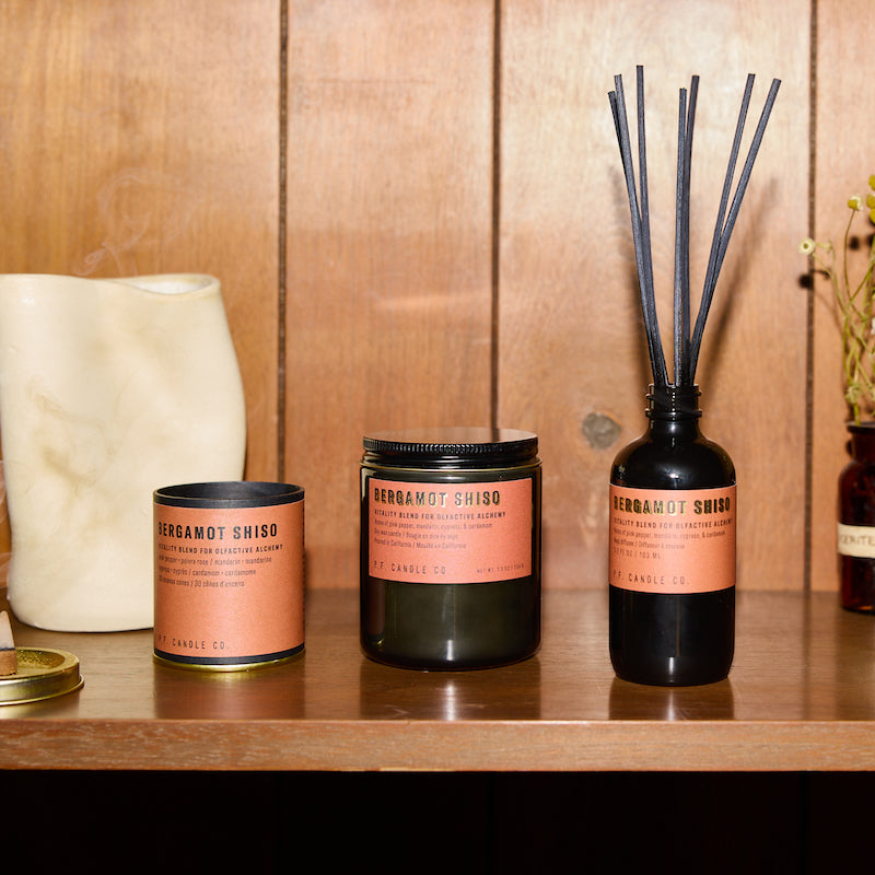 P.F. Candle Co. Bergamot Shiso - Scent Family - Alchemy is a collection of candles, incense cones, and reed diffusers featuring science-backed blends meant to mimic the healing qualities of nature and boost your mood.