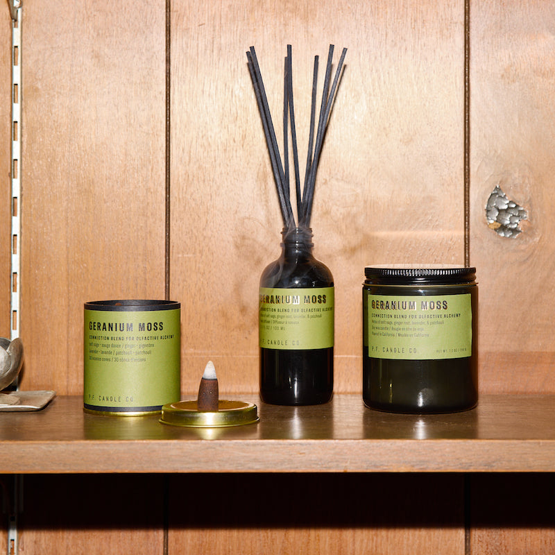 P.F. Candle Co. Geranium Moss - Scent Family - Alchemy is a collection of candles, incense cones, and reed diffusers featuring science-backed blends meant to mimic the healing qualities of nature and boost your mood.