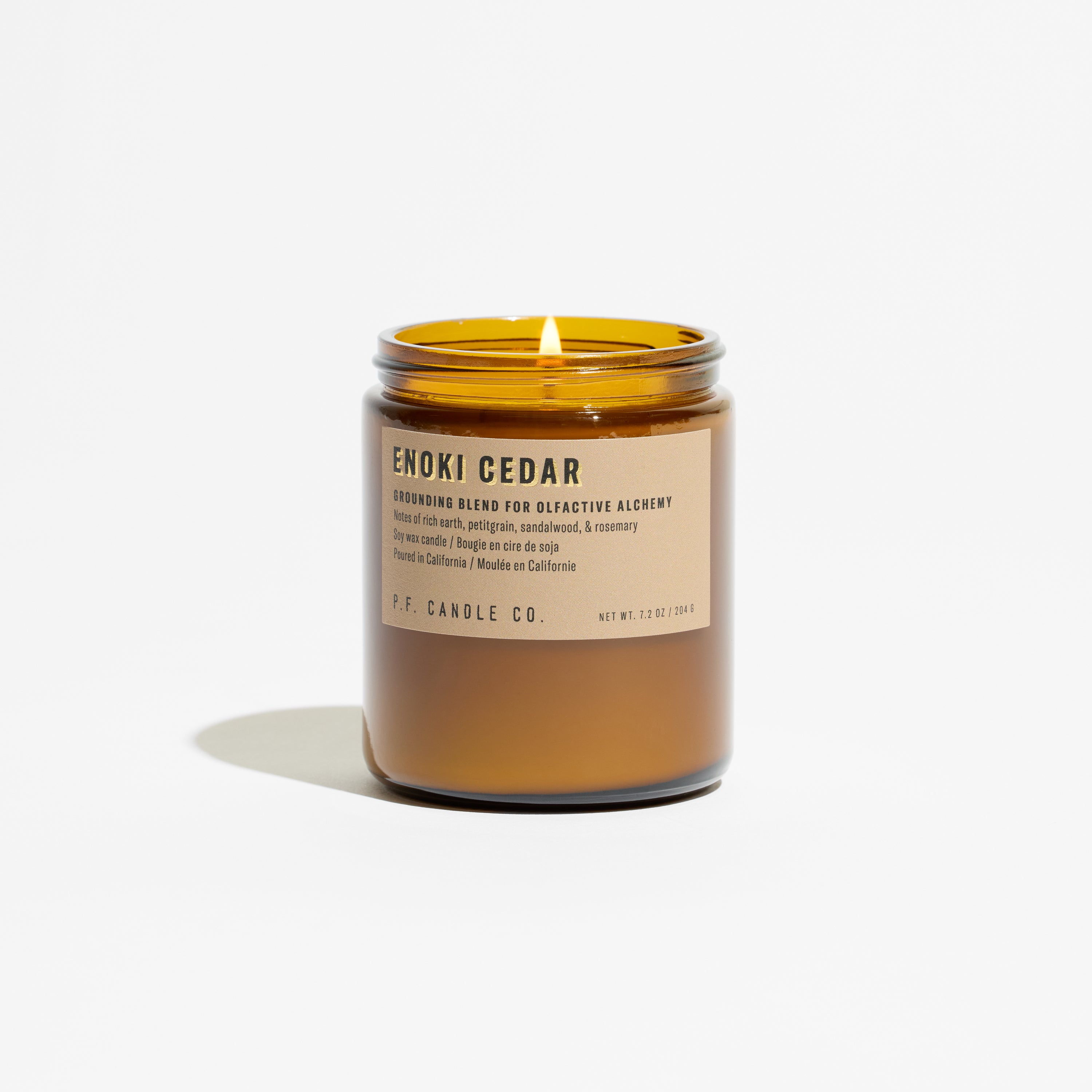 P.F. Candle Co. Enoki Cedar Alchemy Candle flame lit