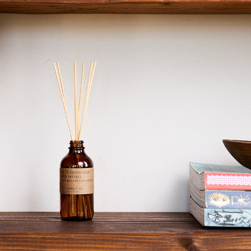 P.F. Candle Co. Golden Coast Reed Diffuser - Lifestyle - Big Sur magic, wild sage baking in the sun, the rumble of waves and rocks. Eucalyptus, sea salt, redwood, and palo santo.