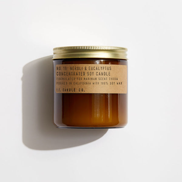 P.F. Candle Co. Neroli & Eucalyptus Large Candle - Product - Hand-poured into apothecary inspired amber jars with our signature kraft label and a brass lid.