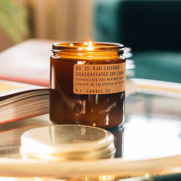 P.F. Candle Co. Ojai Lavender Large Concentrated Candle - Lifestyle - A calming vortex surrounded by sun-drenched fields, orange groves and lavender farms, jagged mountains washed in a rosy, sunset glow. Aromatic, herbal, citrus. Pixie tangerine, blue lavender, coyote mint