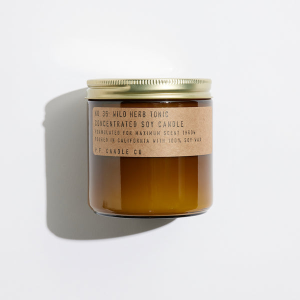 P.F. Candle Co. Wild Herb Tonic Large Concentrated Candle - Product - Hand-poured into apothecary inspired amber jars with our signature kraft label and a brass lid.