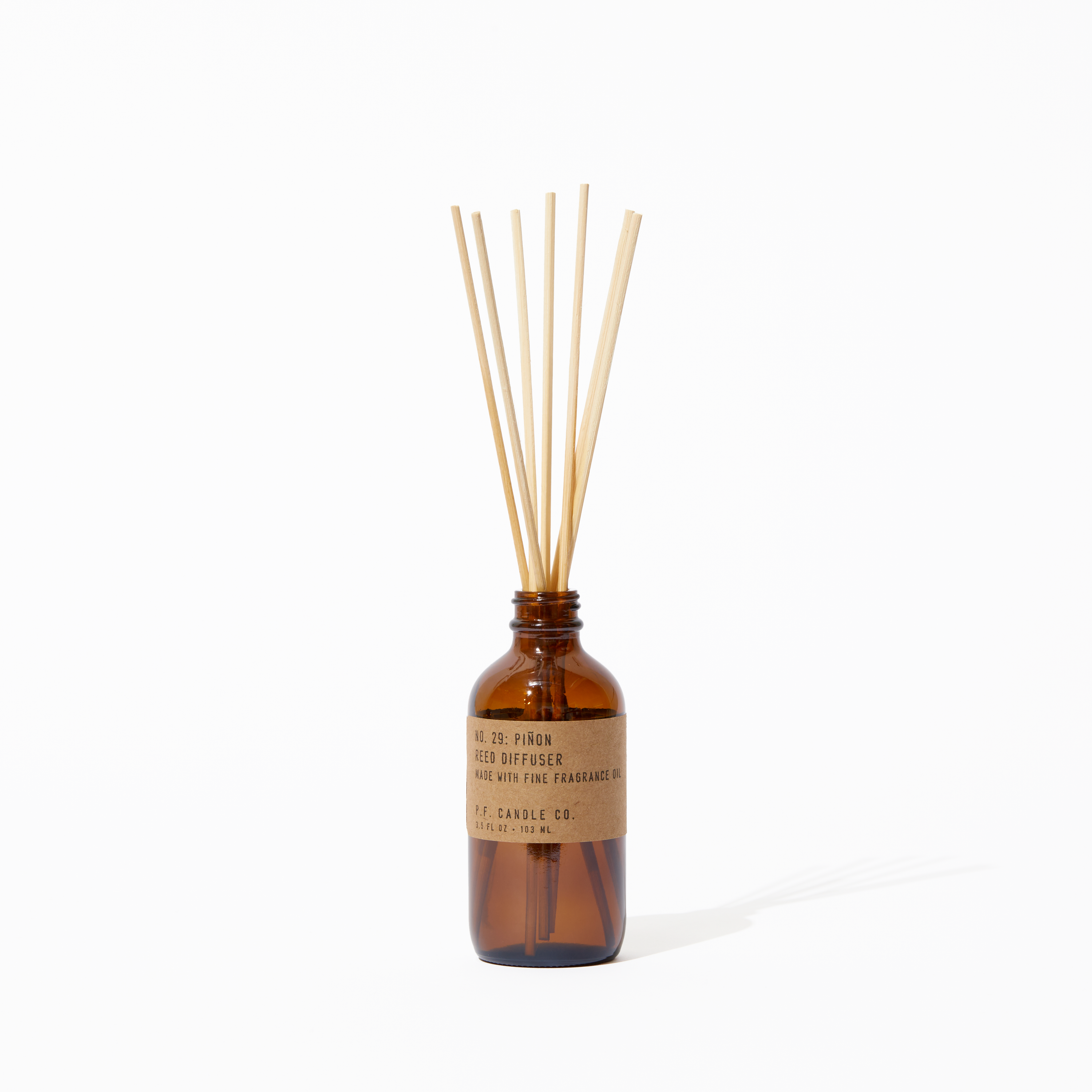 P.F. Candle Co. Piñon Reed Diffuser - Product - Our Reed Diffusers come in apothecary-inspired amber glass bottles with our signature kraft label and rattan reeds. Low-maintenance scent throw, all day long - no match necessary. 