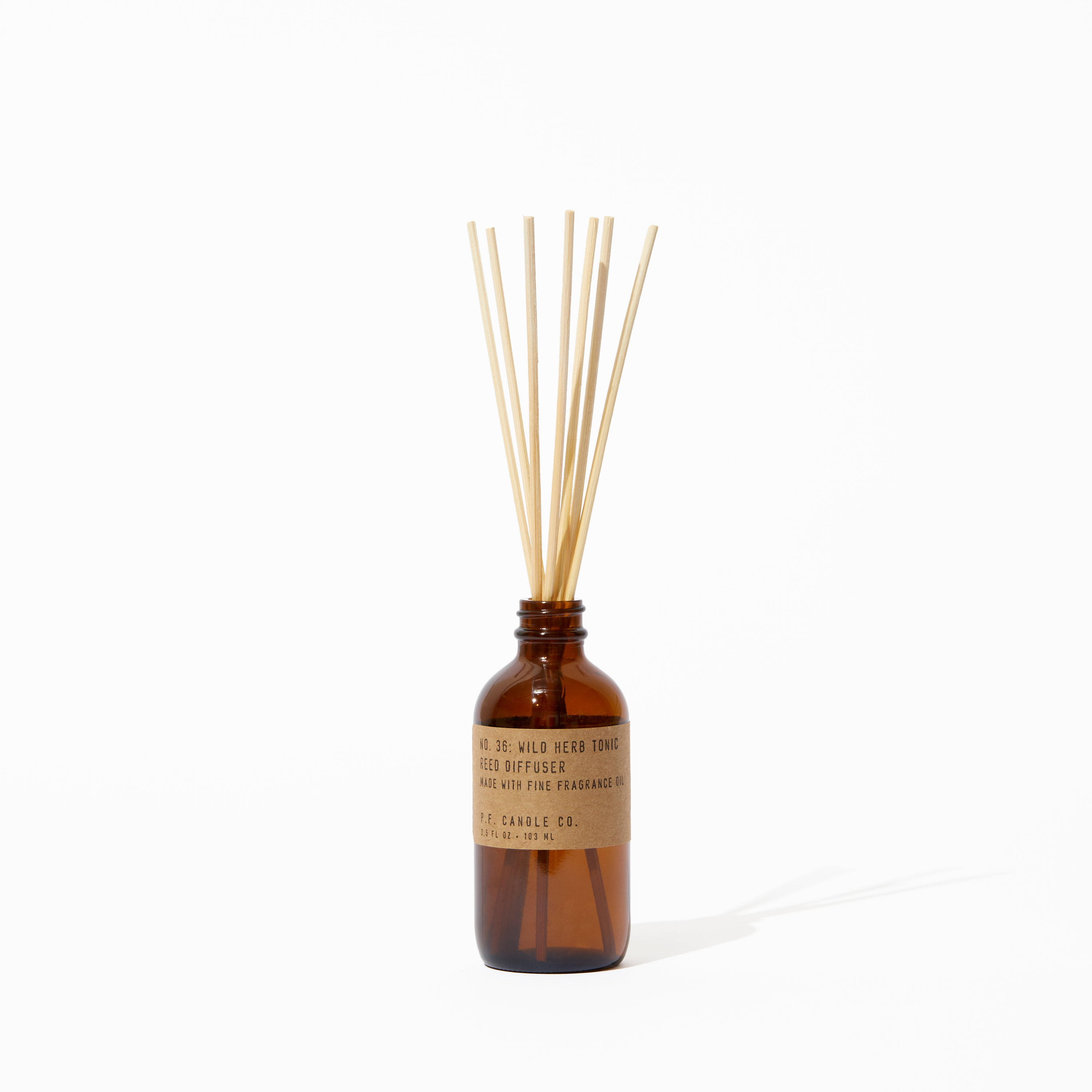 P.F. Candle Co. Wild Herb Tonic Reed Diffuser - Product - Apothecary-inspired amber glass bottles with our signature kraft label and rattan reeds. Low-maintenance scent throw, all day long - no match necessary.