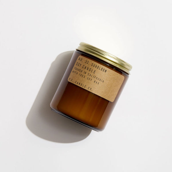P.F. Candle Co. Sunbloom Standard Candle - Product - Hand-poured into apothecary inspired amber jars with our signature kraft label and a brass lid.