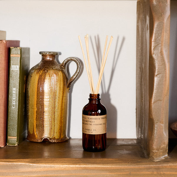 P.F. Candle Co. Teakwood & Tobacco Reed Diffuser - Lifestyle - The one that started it all. Some call it the boyfriend scent, we call it the O.G. Leather, teak, and orange.