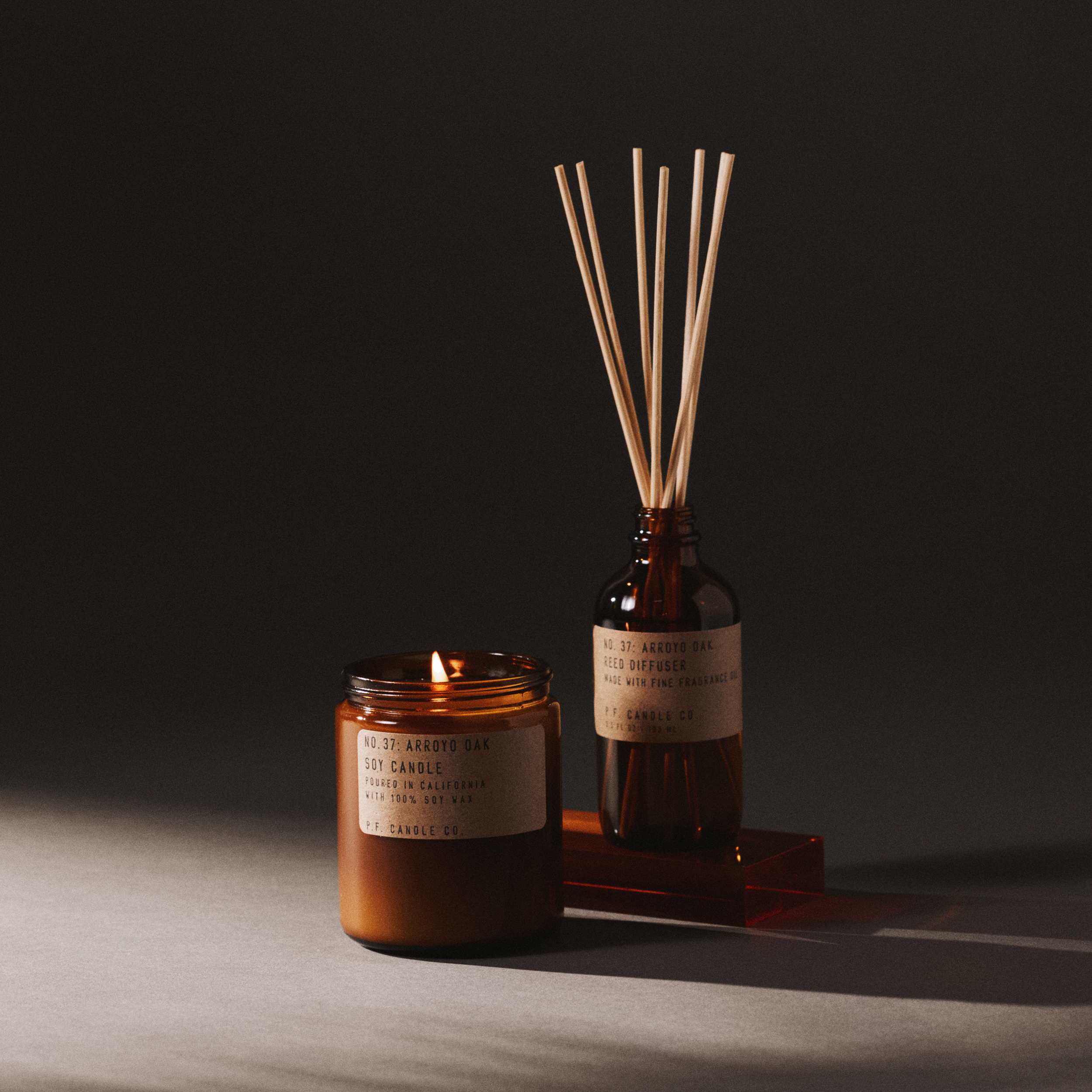 arroyo oak candle and reed diffuser set on a dark background