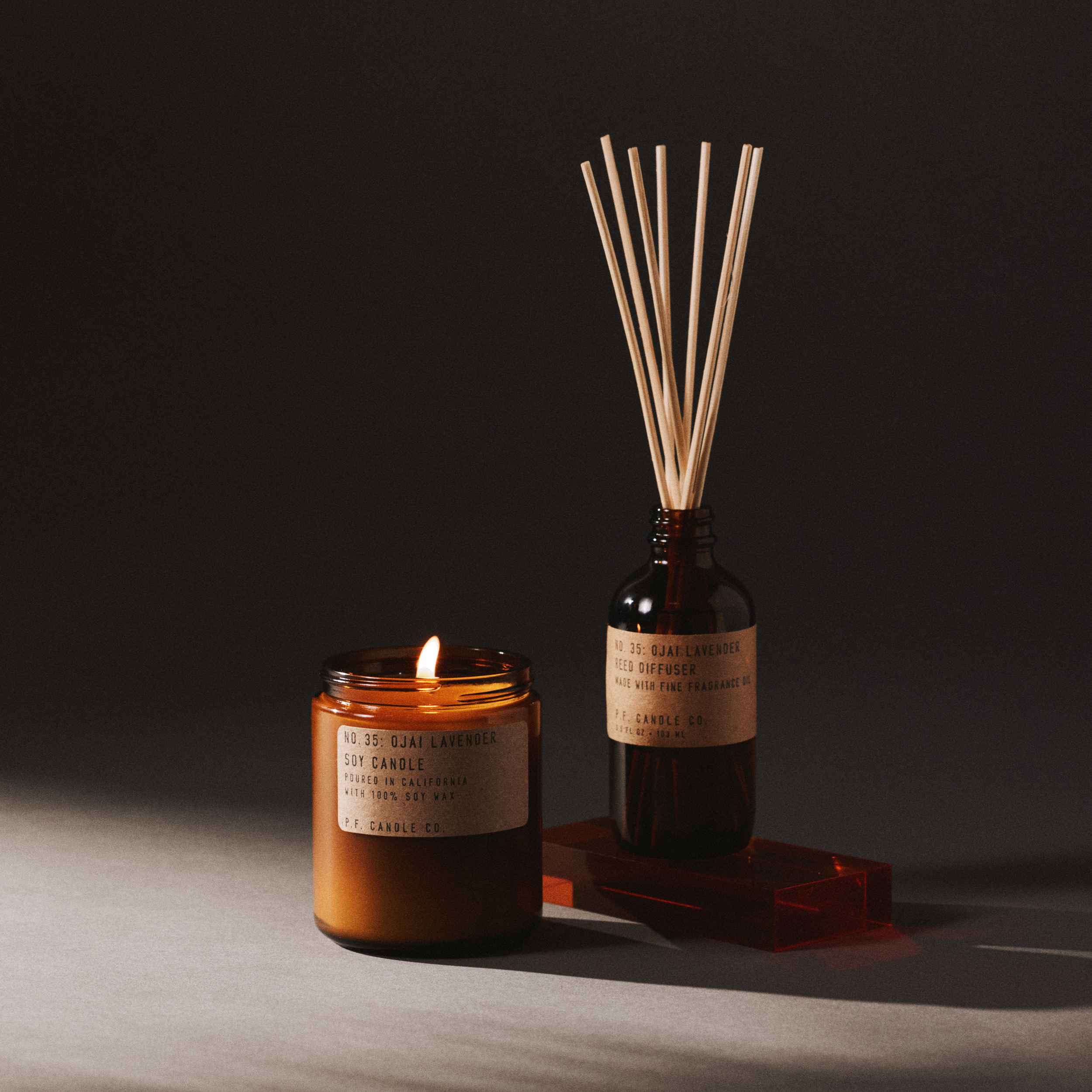 ojai lavender candle and reed diffuser set on a dark background
