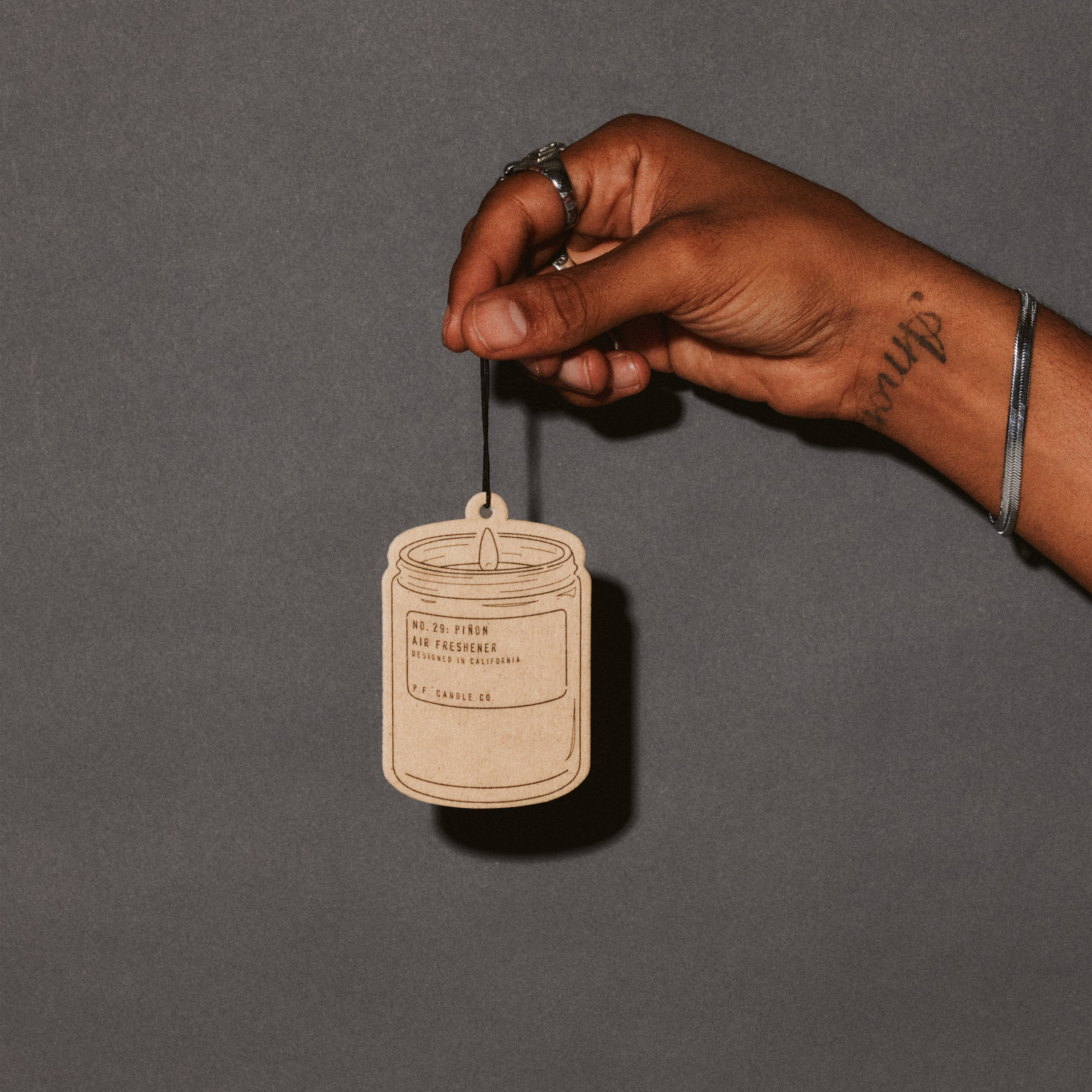 pinon air freshener with hand