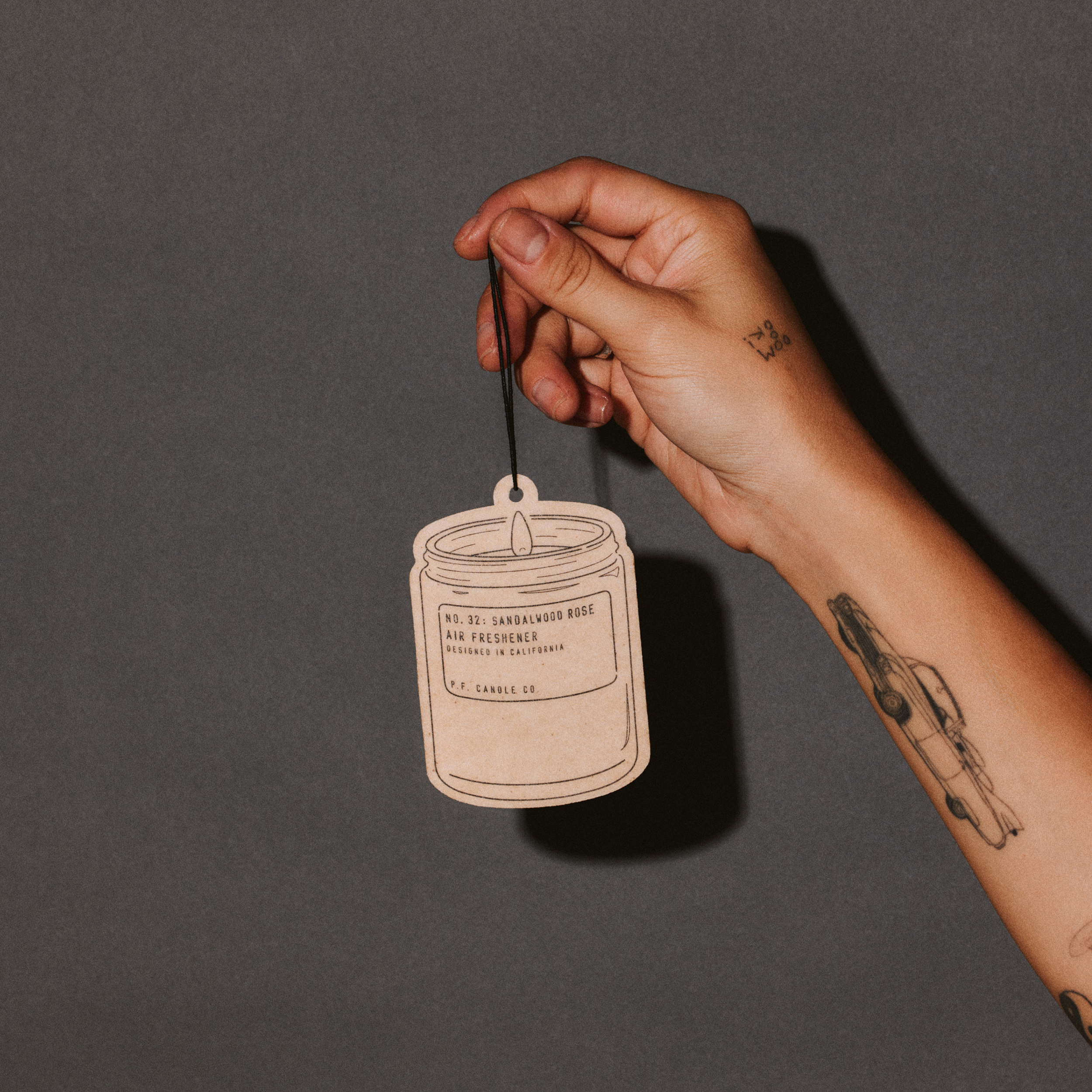 sandalwood rose air freshener with hand