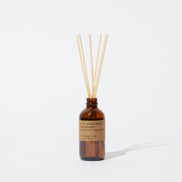 P.F. Candle Co. Golden Coast Reed Diffuser - Product - Our Reed Diffusers come in apothecary-inspired amber glass bottles with our signature kraft label and rattan reeds. Low-maintenance scent throw, all day long - no match necessary.
