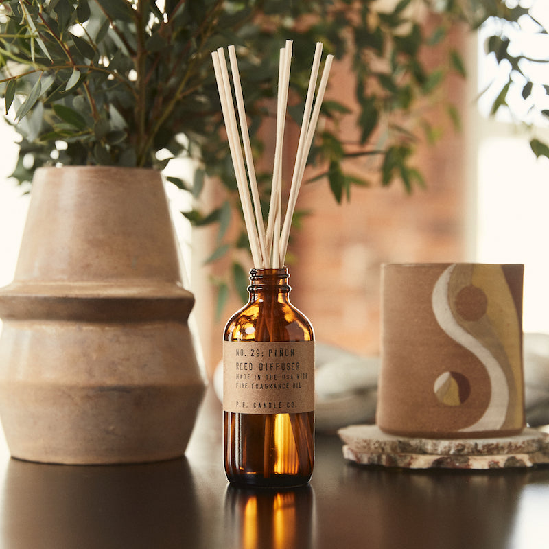 P.F. Candle Co. Piñon Reed Diffuser - Lifestyle - Winters in the Southwest, lingering bonfires, wool jackets in rotation. Piñon logs, cedar, and vanilla.