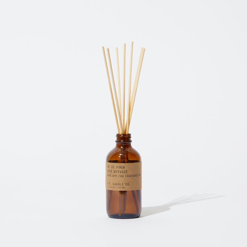 P.F. Candle Co. LA - Piñon Classic 3.5 fl oz Reed Diffuser - Product - Our Reed Diffusers come in apothecary-inspired amber glass bottles with our signature kraft label and rattan reeds. Low-maintenance scent throw, all day long - no match necessary. 