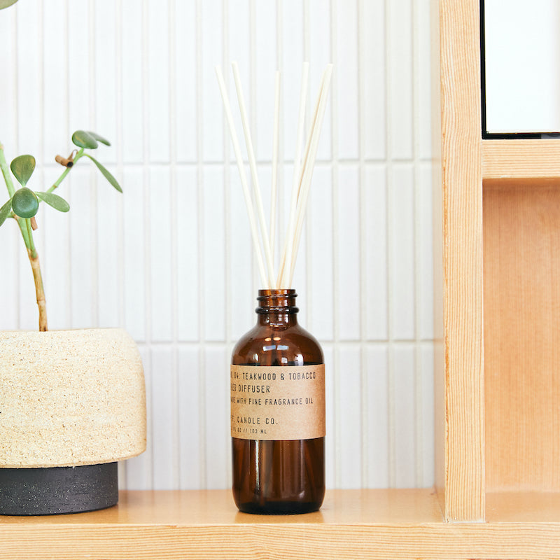 P.F. Candle Co. Los Angeles - Teakwood & Tobacco Classic 3.5 fl oz Scented Reed Diffuser - Lifestyle - The one that started it all. Some call it the boyfriend scent, we call it the O.G. Leather, teak, and orange.