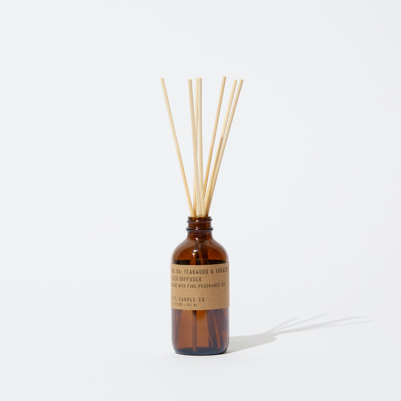 P.F. Candle Co. Teakwood & Tobacco Reed Diffuser - Product - Packaged in apothecary-inspired amber glass bottles with our signature kraft label and rattan reeds. Low-maintenance scent throw, all day long - no match necessary.