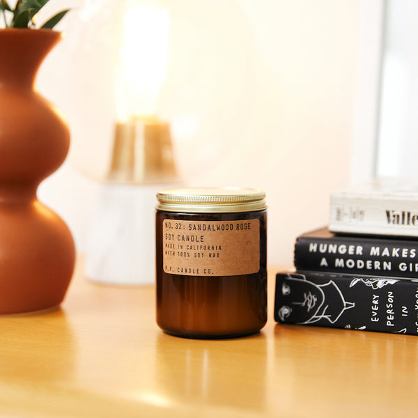 P.F. Candle Co. Sandalwood Rose Standard Candle - Lifestyle - New York meets Los Angeles. Cashmere rose, oud, and sandalwood.