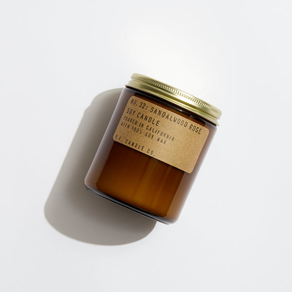 P.F. Candle Co. Sandalwood Rose Standard Candle - Product - Hand-poured into apothecary inspired amber jars with our signature kraft label and a brass lid.