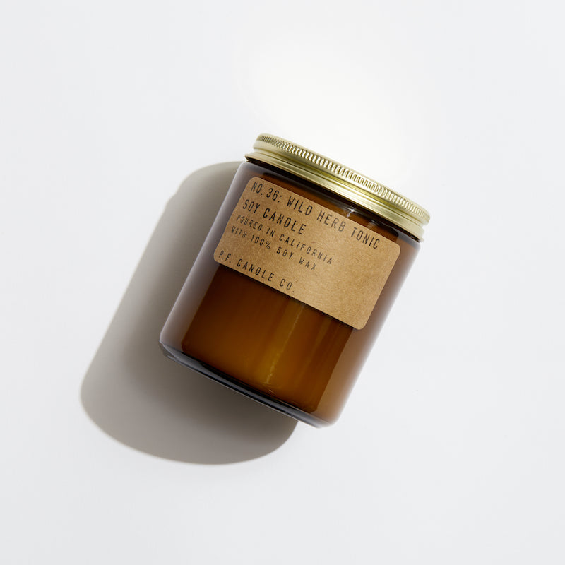 P.F. Candle Co. Wild Herb Tonic Standard Candle - Product - Hand-poured into apothecary inspired amber jars with our signature kraft label and a brass lid.